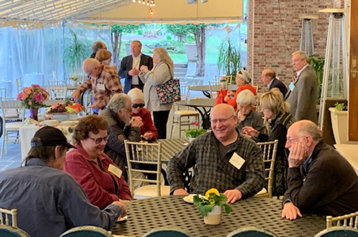 People at table on the Endicott House patio